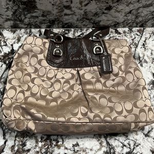 Coach handbag; 15x10x3, light shimmer tan with dark brown leather trim.